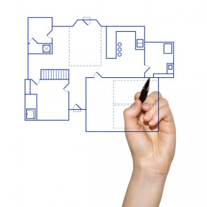 architect drafting a house blueprint